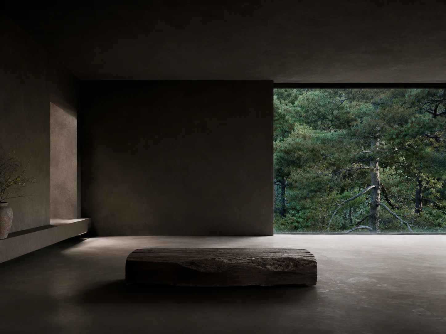 A minimalist dark concrete interior with a low rustic timber bench positioned before a large window overlooking a dense pine forest.