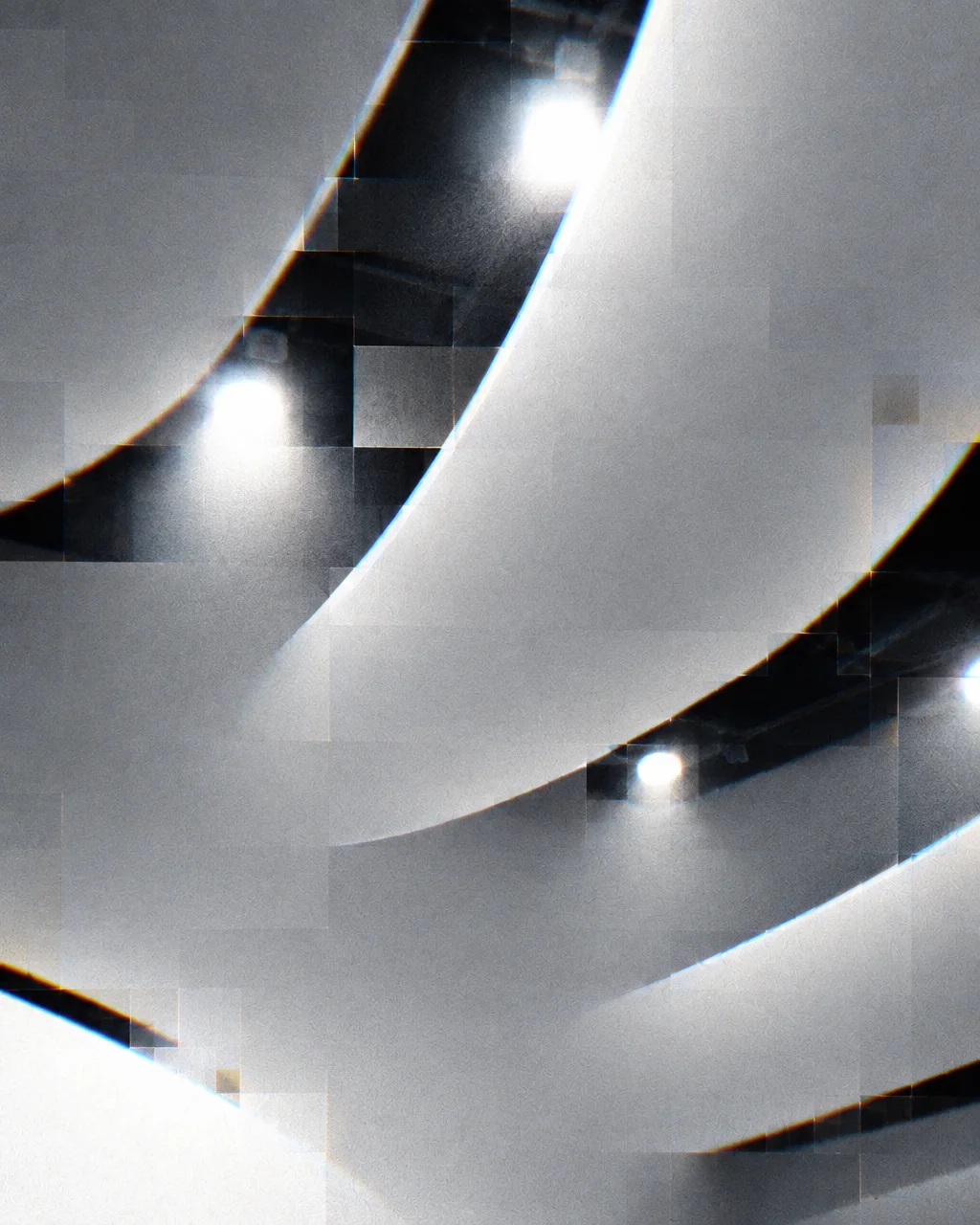Curving architectural surfaces illuminated by spotlights, overlaid with digital pixelation and subtle chromatic aberration.