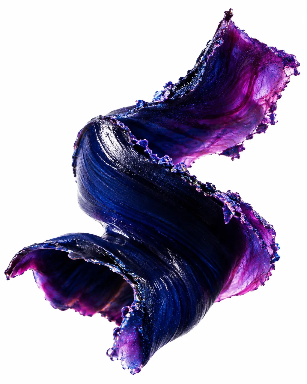 A dynamic, thick ribbon of deep blue and shimmering violet cosmetic pigment curling against a stark white background.