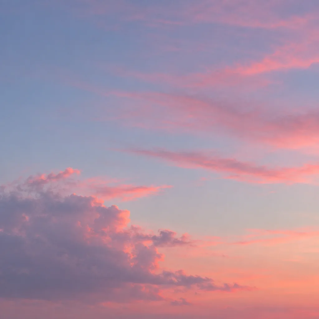 Soft pink and lavender clouds drift across a pale blue and pastel sunset sky.