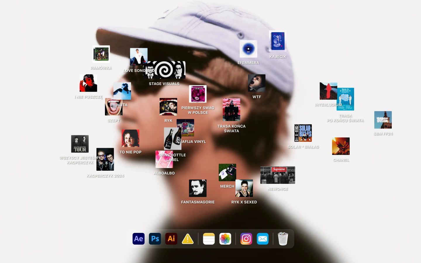 A playful desktop workspace with scattered project artwork floating across a blurred photographic silhouette above an OS dock.