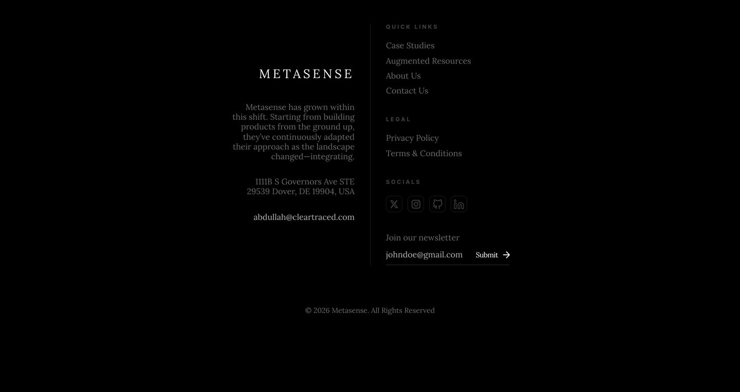 A quiet, dark footer anchored by sparse serif typography and generous negative space.
