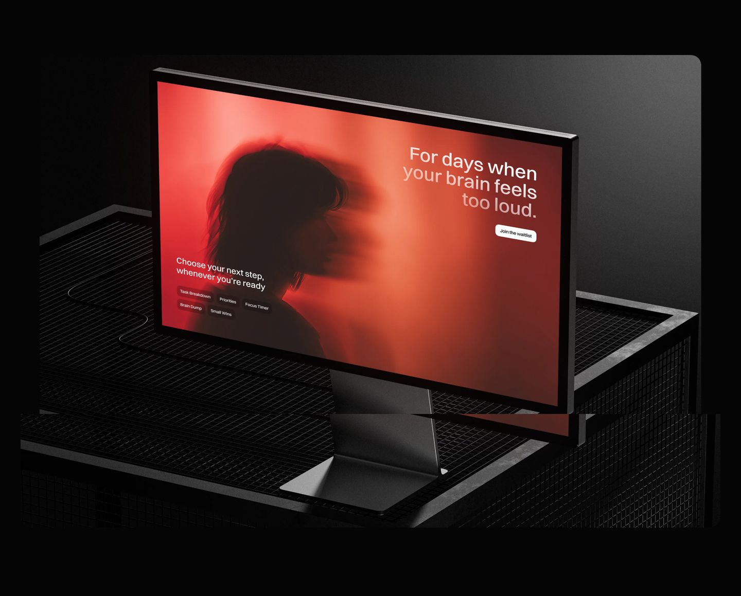 A moody 3D monitor mockup glowing with intense crimson light against a dark industrial setting.