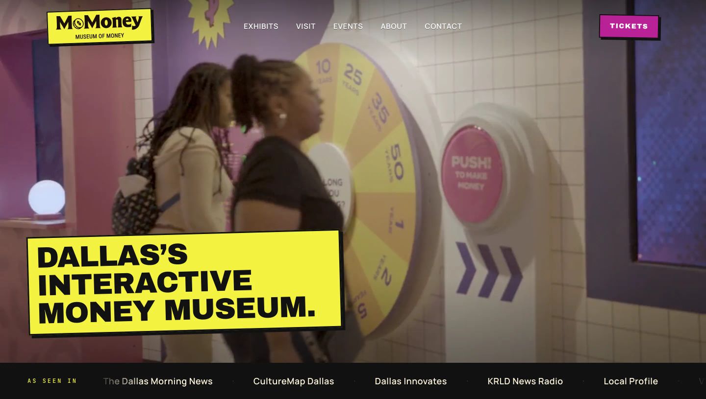 High-energy interactive museum hero pairing experiential video with bold, graphic pop-art sticker typography in vibrant yellow and magenta.