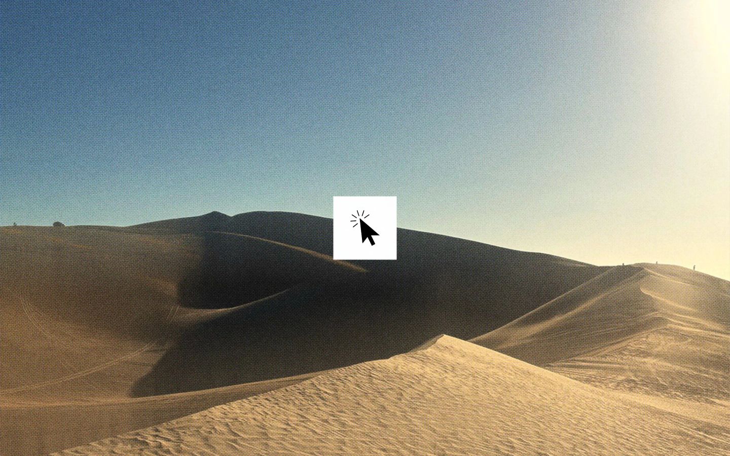 A vast sunlit desert landscape under a pale blue sky, anchored by a mysterious clicking cursor prompt at the center.