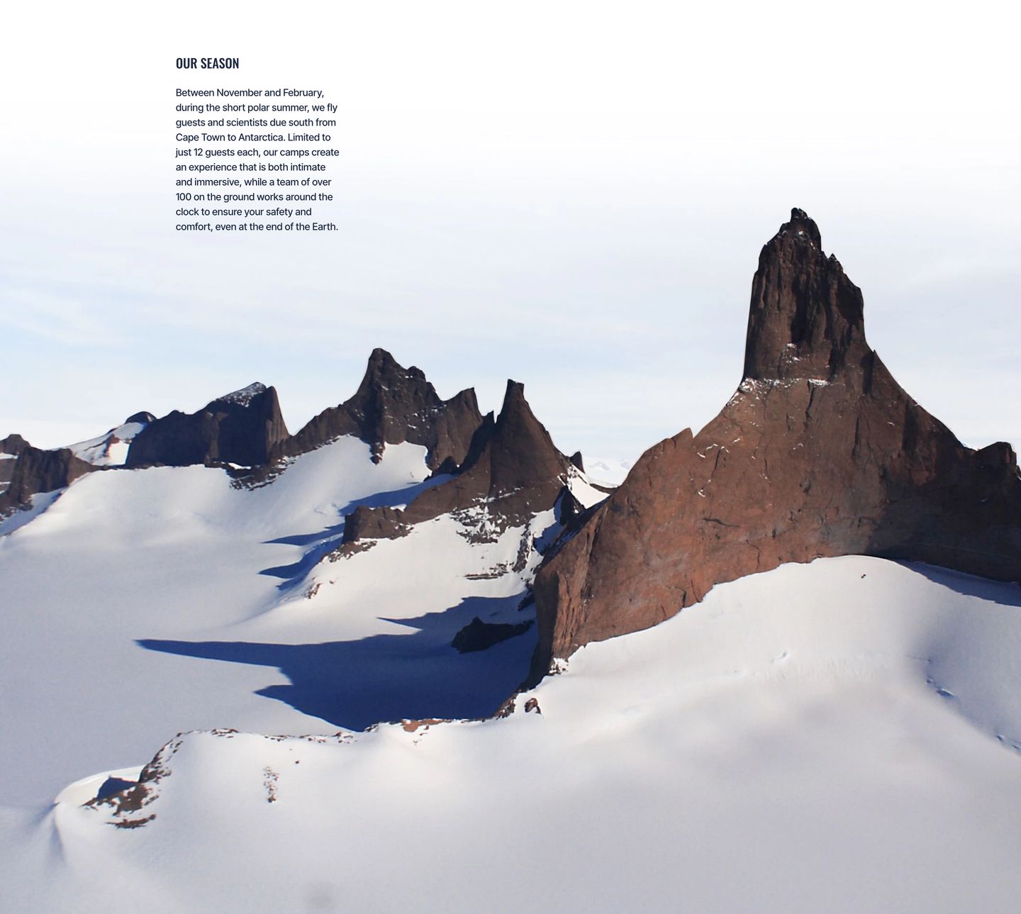 Vast polar landscape with understated editorial typography tucked into the quiet, expansive white sky.