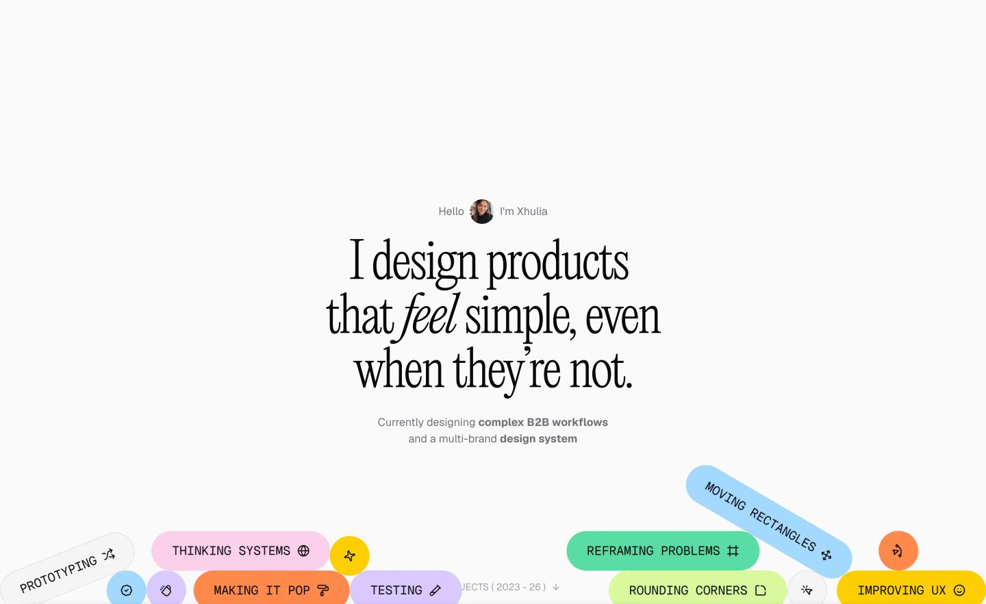 Clean and airy portfolio hero combining refined editorial serif typography with a cluster of vibrant, playful skill pills.
